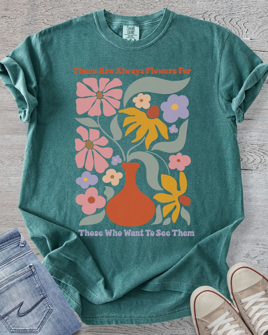 Comfort Colors t-shirt in Blue Spruce featuring floral design and text.